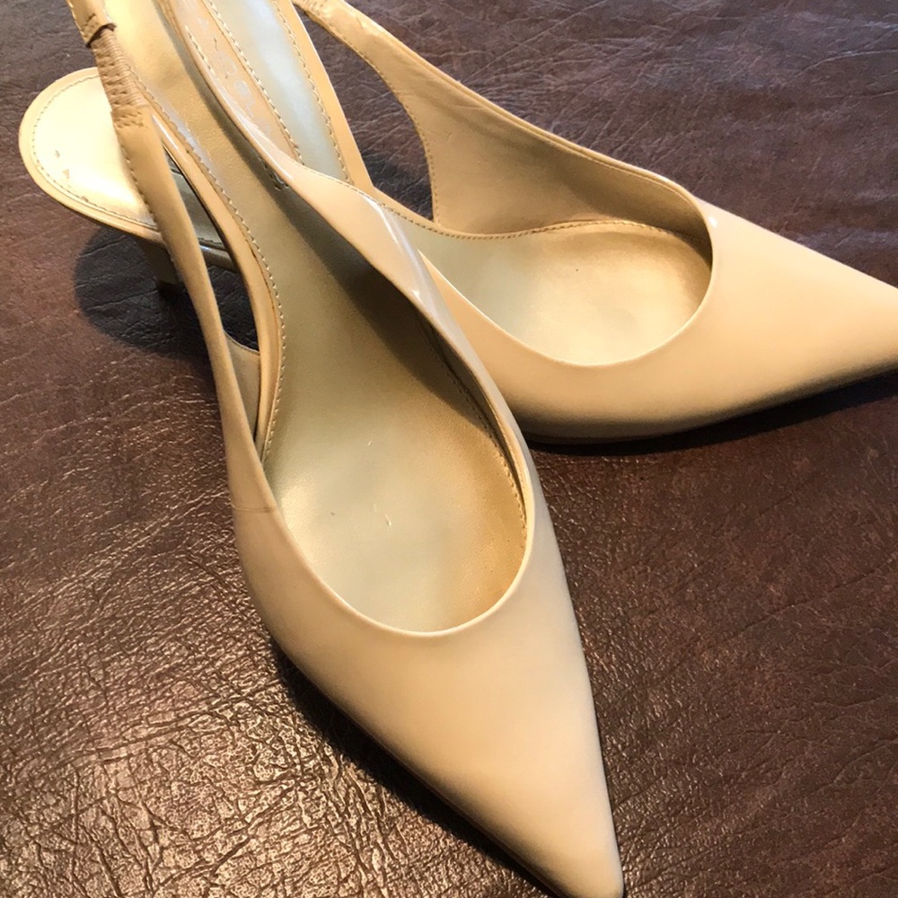 Sling back heels in a tan patent leather